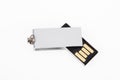 USB Key silver Flash Drive rotating Stick Memory on white desk background