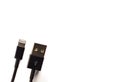 USB-Lightning mobile charging cable on white backgound Royalty Free Stock Photo