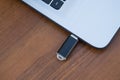 USB memory stick or flash drive attached to the side of a laptop Royalty Free Stock Photo