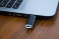 USB memory stick or flash drive attached to the side of a laptop Royalty Free Stock Photo