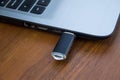 USB memory stick or flash drive attached to the side of a laptop Royalty Free Stock Photo