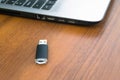 USB memory stick or flash drive and laptop computer Royalty Free Stock Photo