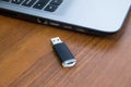 USB memory stick or flash drive and laptop computer Royalty Free Stock Photo