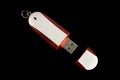 USB Memory Stick - Metal and red flash drive on an isolated black background Royalty Free Stock Photo
