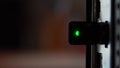 Usb modem wifi inserted into the computer close-up. The modem flashes a green light. Computer view from the back. Royalty Free Stock Photo