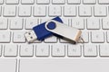 USB pen drive arranged on white keyboard Royalty Free Stock Photo