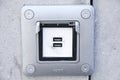 USB ports electronic plug on cement wall Royalty Free Stock Photo