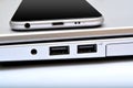 USB ports with smartphone laptop closeup