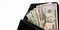 USD cash money in a big pile. Paper money in a black, leather wallet close up. Royalty Free Stock Photo
