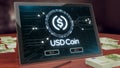 Usd coin cryptocurrency logo on the pc tablet display. Neon bright blockchain symbol.