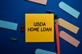 USDA Home Loan write on sticky note isolated on Office Desk