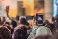 Use advanced mobile recording, fun concerts and beautiful lighting, Candid image of crowd at rock concert, Close up of Royalty Free Stock Photo