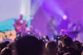 Use advanced mobile recording, fun concerts and beautiful lighting, Candid image of crowd at rock concert, Close up of