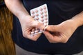 Use of antibiotics drugs during the COVID-19 pandemic, coronavirus, person holding a pack of pills Royalty Free Stock Photo