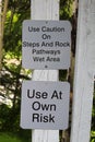 Use caution on steps and rocks sign