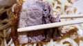 Use the chopsticks to eat the meats Royalty Free Stock Photo