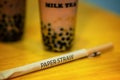 Use a eco-friendly brown paper straw to drink pearl milk tea Royalty Free Stock Photo