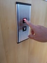 Use index finger to press the elevator button up and down Royalty Free Stock Photo