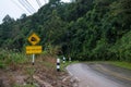 Use low gear sign country road in mountain after raining wet road