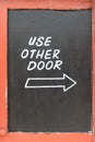 Use other door, with arrow