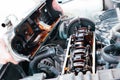 Car repair. The use of poor quality oil in the engine. Deposits of tar from oil on the inside of the engine. The mechanic examines