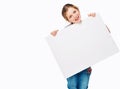 Use this space to spread the word. Studio shot of an adorable little girl holding a blank placard. Royalty Free Stock Photo