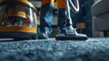 Use a vacuum cleaner to clean the carpet. Selective focus. Royalty Free Stock Photo