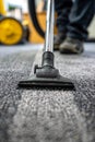 Use a vacuum cleaner to clean the carpet. Selective focus. Royalty Free Stock Photo