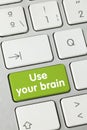 Use your brain - Inscription on Green Keyboard Key Royalty Free Stock Photo