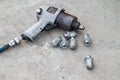 Used air impact wrench and bolts from repair tire Royalty Free Stock Photo