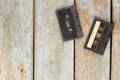 Used audio cassettes on old wooden floor.