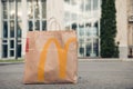 Used bags from food purchased at a fast food restaurant McDonald`s . Environmental pollution. Moscow, Russia, July 2020