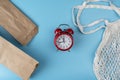 Used bags made from recycle paper with cotton bag, with red alarm clock