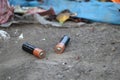 Used batteries are lying on the garbage dump Royalty Free Stock Photo