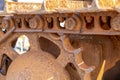 A close up of ruster caterpillar tracks on a dozer