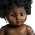 Used black doll in front of a white background Royalty Free Stock Photo