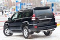 Used black Toyota Land Cruiser Prado 2007 release with an engine of 4 liters rear view on the car snow parking after preparing for