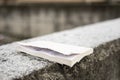 Used book on a grey wall covered with thin ice frosty snow Royalty Free Stock Photo