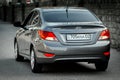 Used budget korean car b class in gray color, back angle view sedan