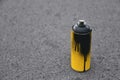 Used can of spray paint on asphalt Royalty Free Stock Photo