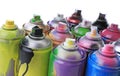 Used cans of spray paints on white background, closeup. Graffiti supplies Royalty Free Stock Photo