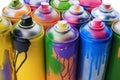 Used cans of spray paints on white background, closeup. Graffiti supplies Royalty Free Stock Photo