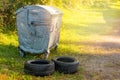 Used car tires left beside the garbage container Royalty Free Stock Photo