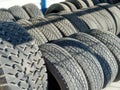 Used car tires. Rubber wheel tires. Recycling of old worn-out truck tires. Background Royalty Free Stock Photo