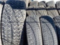 Used car tires. Rubber wheel tires. Recycling of old worn-out truck tires. Background Royalty Free Stock Photo