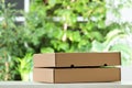 Used cardboard boxes on blurred background. Royalty Free Stock Photo
