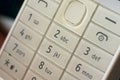 White classic keyboard of the phone in use Royalty Free Stock Photo