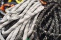 Used climbing equipment - carabiner without scratches, climbing hammer, white helmet and grey,red,green and black rope Royalty Free Stock Photo