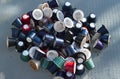 Used coffee capsules of various colors and flavors