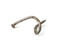 Used crooked rusty nailes on a white. Perseverance and strength Royalty Free Stock Photo